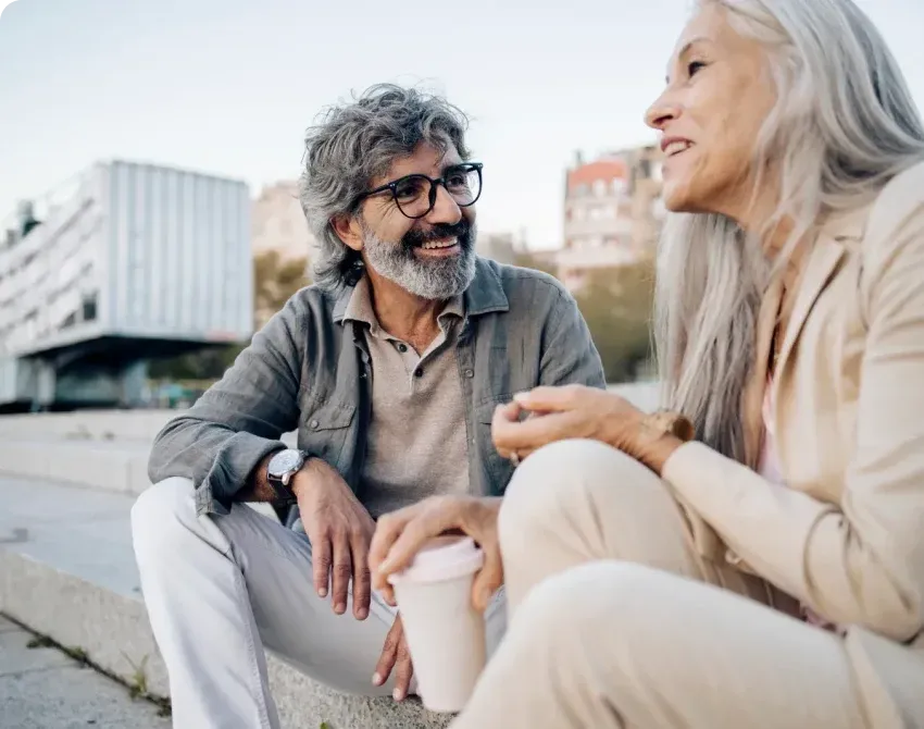 Happy seniors enjoying a conversation outside