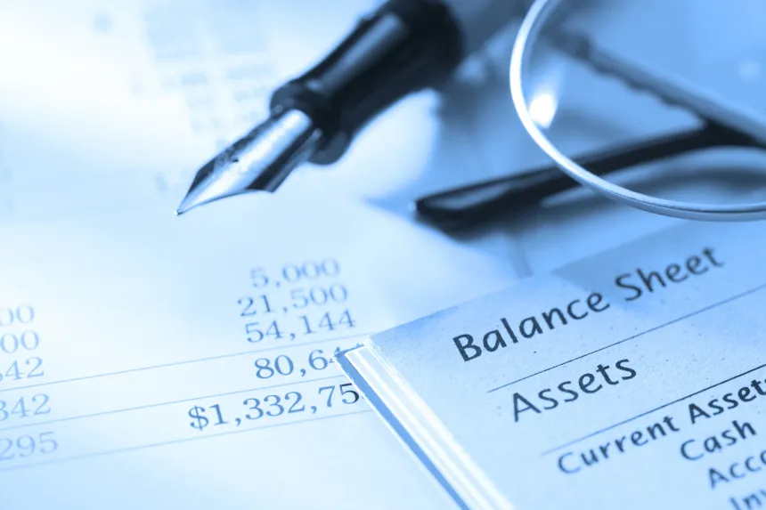 Close up of a fountain pen on a balance sheet