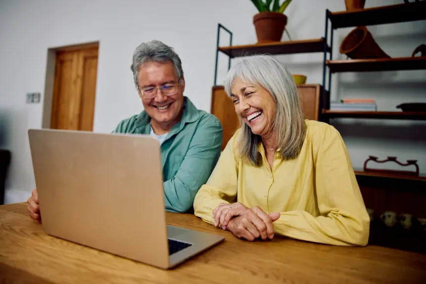 A senior couple embracing outdoors