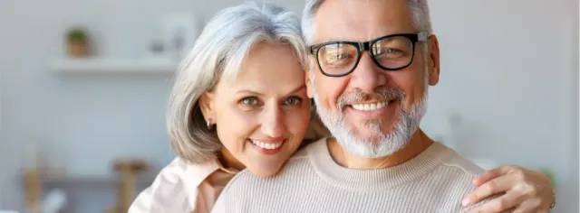 A couple smiling together outdoors